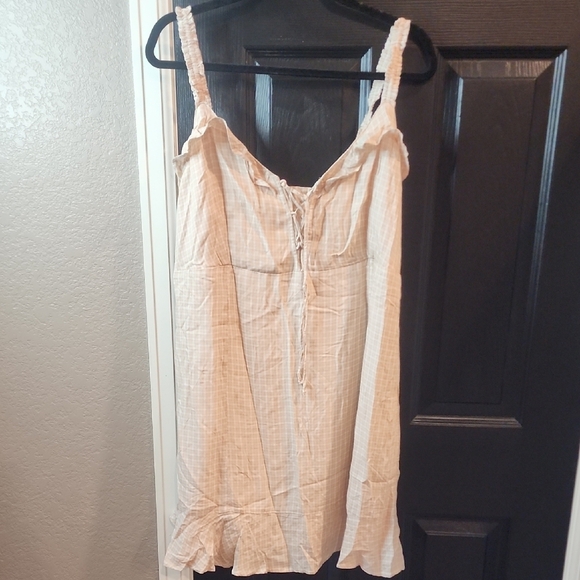 Cream Sleeveless Dress with Ruffle Hem - Picture 1 of 3
